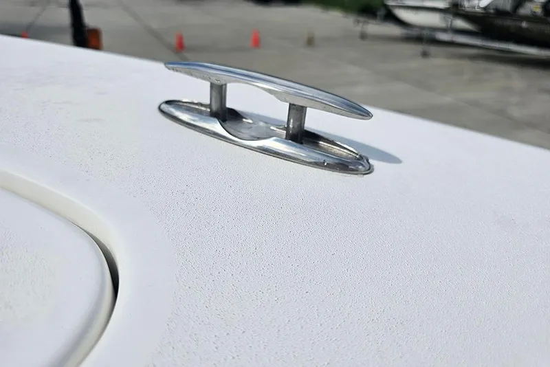 Slide: The Image of 2026 Sea Pro 225 Sandbar boat cleat on white deck, close-up view. - 31