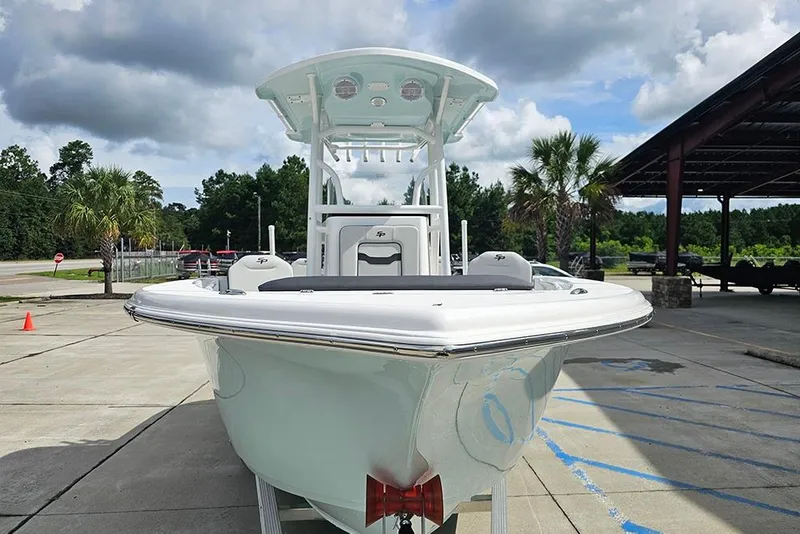 Slide: The Image of 2026 Sea Pro 225 Sandbar boat displayed outdoors under cloudy sky. - 4