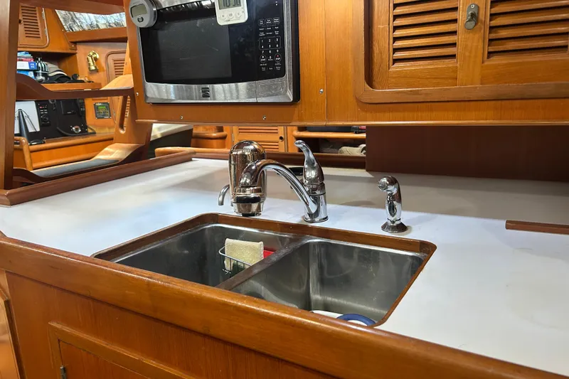 Slide: The Image of Galley kitchen in 1995 Tayana 48 yacht with sink and microwave. - 26
