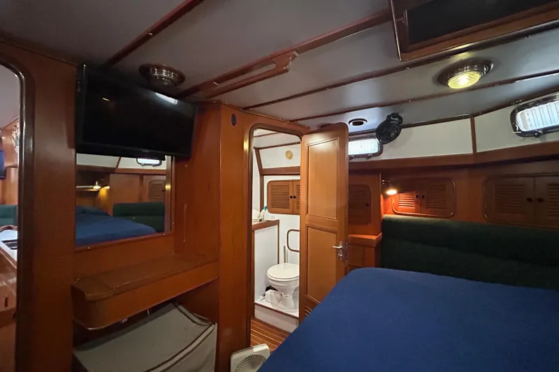 Slide: The Image of Interior of 1995 Tayana 48 yacht with cozy cabin and bathroom. - 35