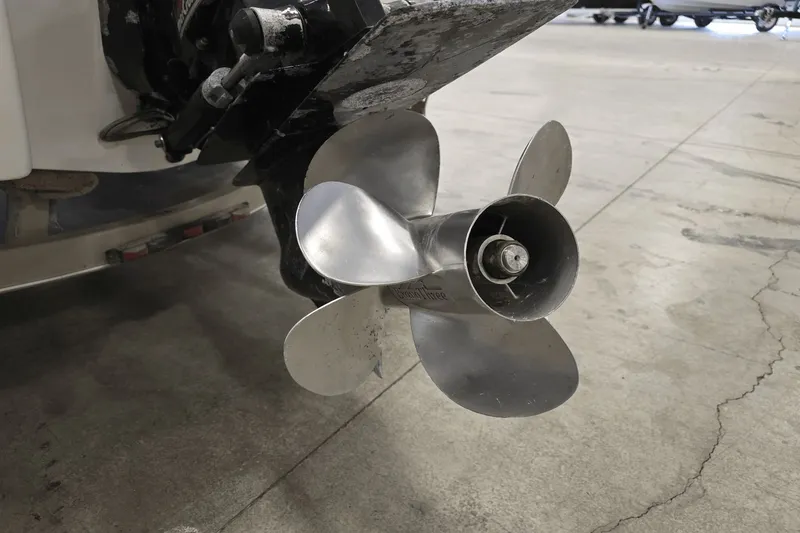 Slide: The Image of Close-up of a 1998 Chaparral Signature 240 boat propeller in a garage setting. - 2