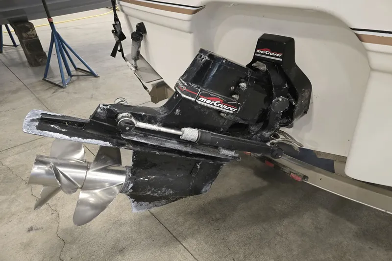 Slide: The Image of 1998 Chaparral Signature 240 boat with MerCruiser outdrive and stainless steel propeller. - 3