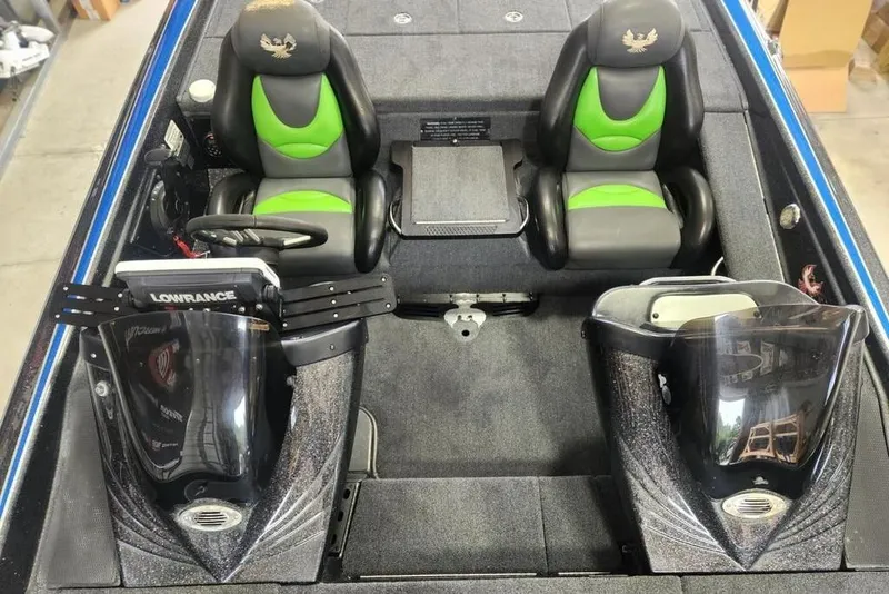 Slide: The Image of 2014 Phoenix 920 ProXP boat interior with dual seats and Lowrance electronics. - 6