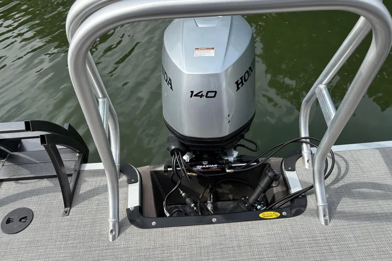 Slide: The Image of 2025 Bentley Pontoons Legacy Navigator with Honda 140 outboard motor on water. - 4