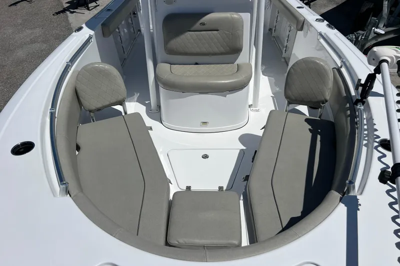 Slide: The Image of 2021 Sportsman Open 232 Center Console boat interior with cushioned seating and modern design. - 14