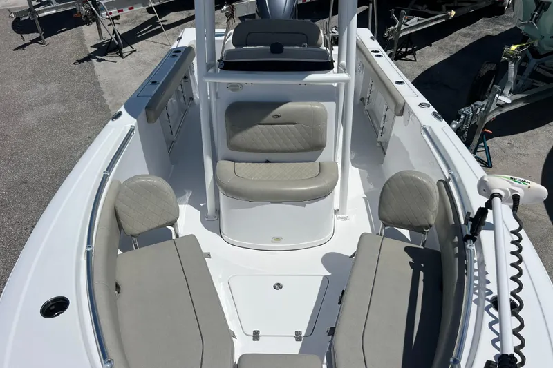 Slide: The Image of 2021 Sportsman Open 232 Center Console boat interior with seating and console view. - 15