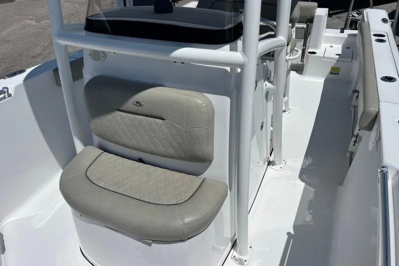 Slide: The Image of 2021 Sportsman Open 232 Center Console boat interior with cushioned seating. - 16