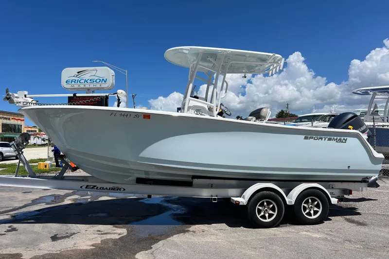 Slide: The Image of 2021 Sportsman Open 232 Center Console boat on trailer at Erickson Marine. - 2