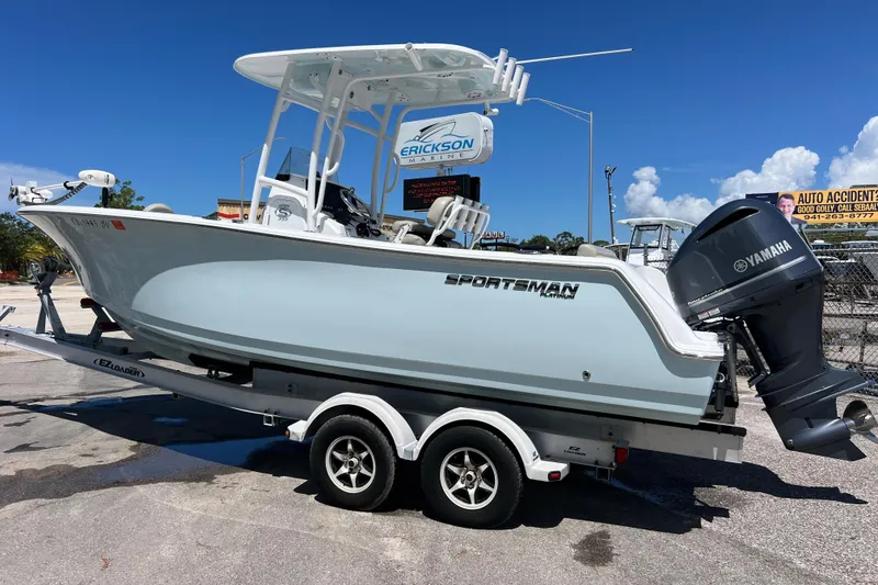 Slide: The Image of 2021 Sportsman Open 232 Center Console boat on trailer with Yamaha outboard motor. - 3