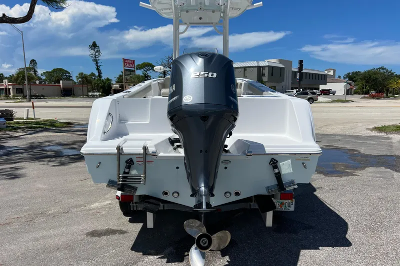 Slide: The Image of 2021 Sportsman Open 232 Center Console boat with Yamaha 250 engine, parked outdoors. - 5