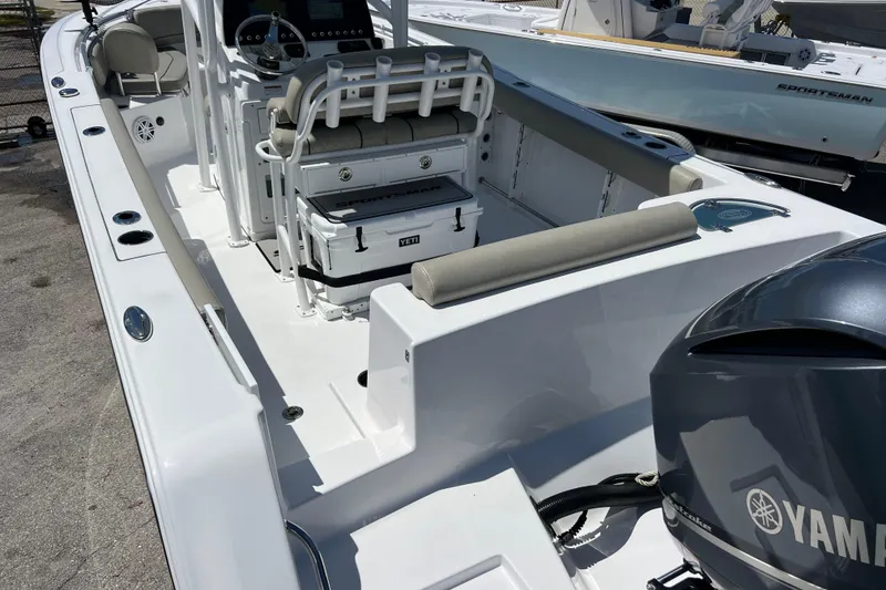 Slide: The Image of 2021 Sportsman Open 232 Center Console boat with Yamaha engine, featuring spacious deck and seating. - 6