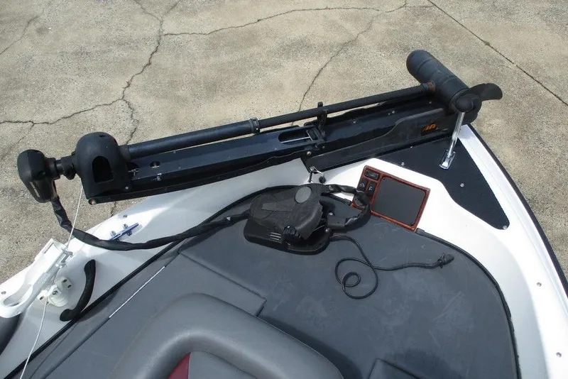 Slide: The Image of 2002 Triton TR-21 SFB boat deck with trolling motor and fish finder. - 6