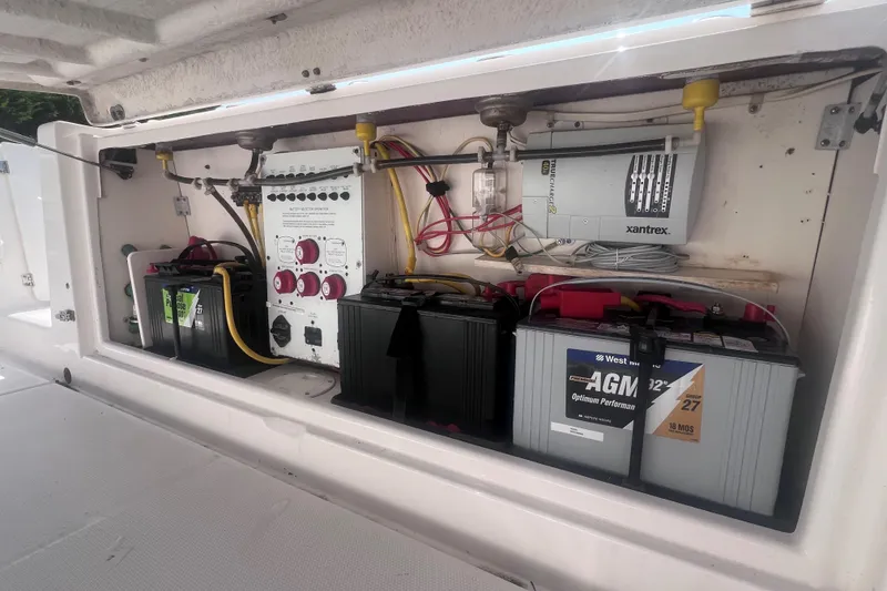 Slide: The Image of 2007 Robalo R305 Walkaround boat battery compartment with electrical system and Xantrex charger. - 11