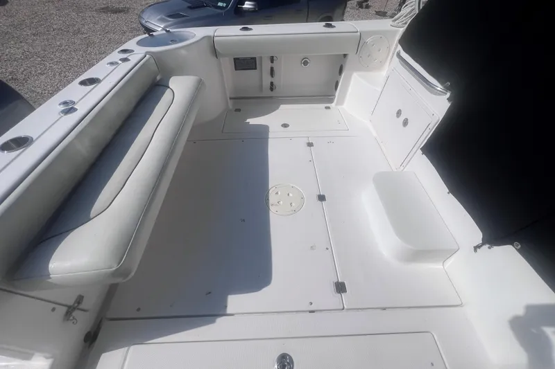 Slide: The Image of 2007 Robalo R305 Walkaround boat interior with seating and storage compartments. - 13