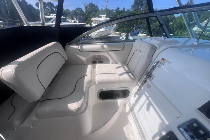 Slide: The Image of 2007 Robalo R305 Walkaround boat interior with white seating and modern design. - 17