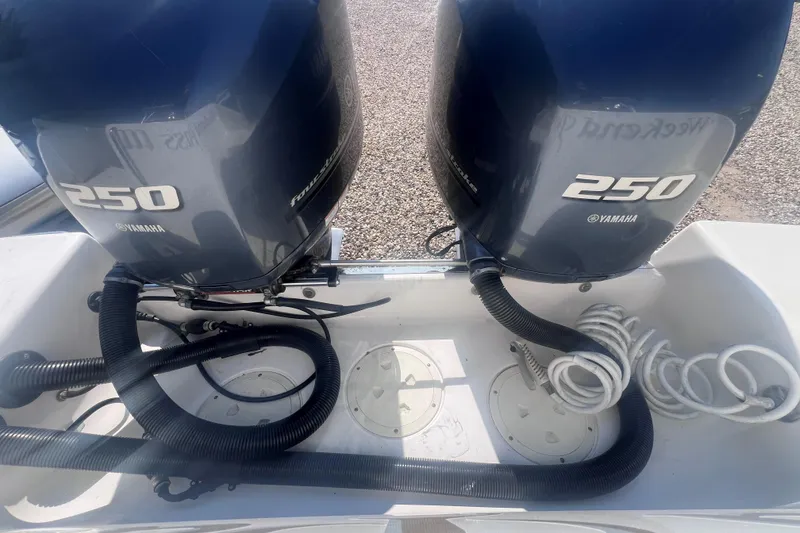 Slide: The Image of Twin Yamaha 250 engines on a 2007 Robalo R305 Walkaround boat. - 7
