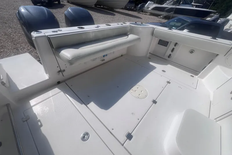 Slide: The Image of 2007 Robalo R305 Walkaround boat deck with seating and storage compartments. - 8