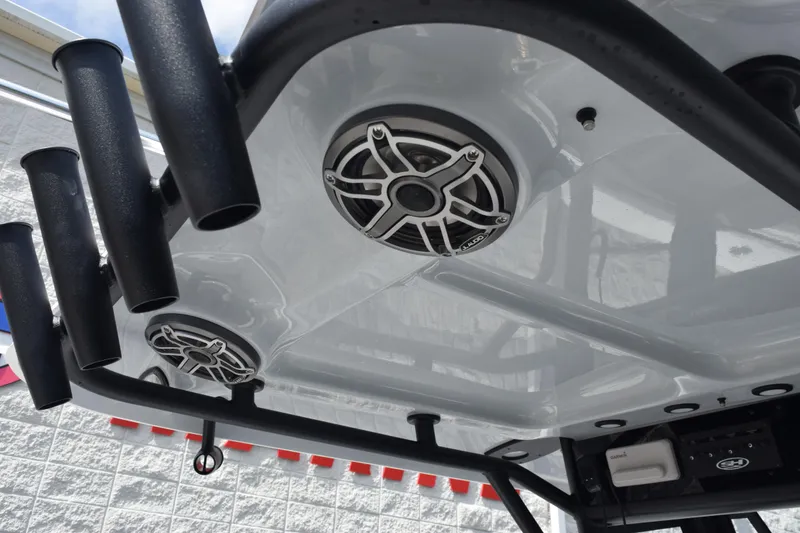 Slide: The Image of 2026 Sea Hunt Gamefish 25 boat speakers and rod holders on T-top. - 11
