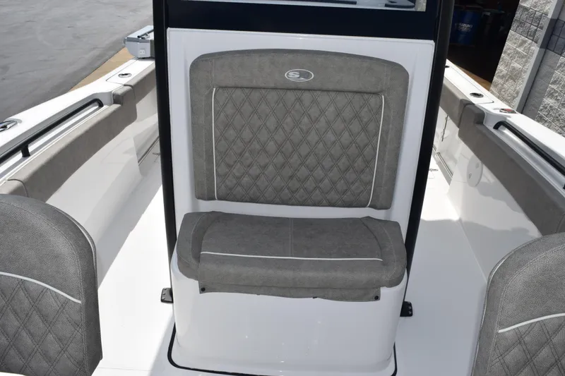 Slide: The Image of 2026 Sea Hunt Gamefish 25 boat interior with gray cushioned seating. - 14