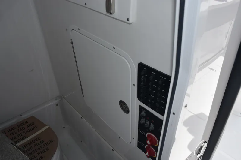 Slide: The Image of 2026 Sea Hunt Gamefish 25 interior control panel and storage compartment. - 21