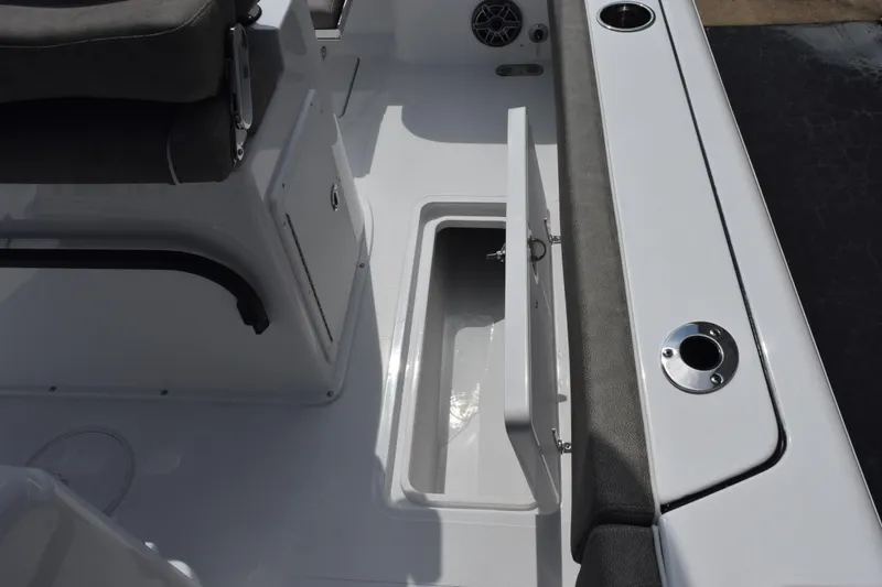 Slide: The Image of 2026 Sea Hunt Gamefish 25 boat interior with open storage compartment. - 22
