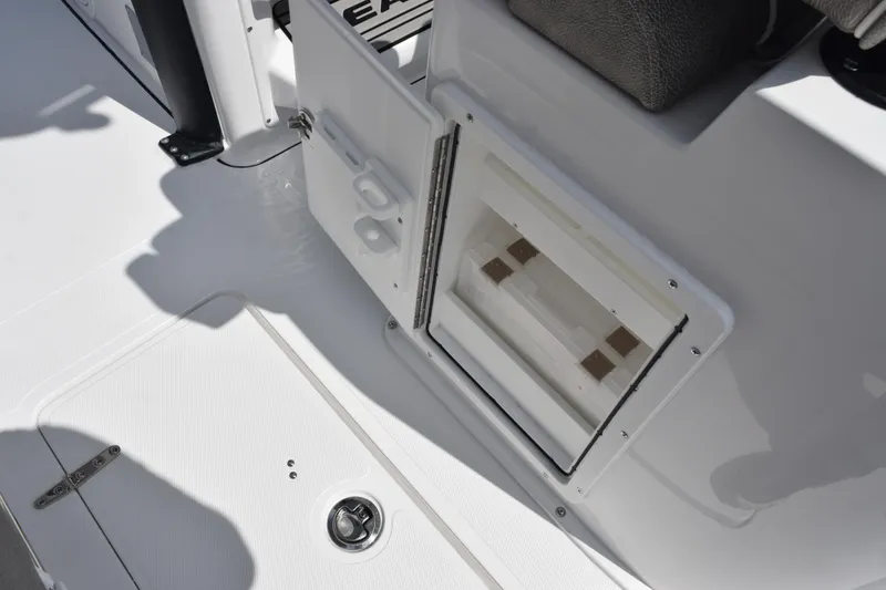 Slide: The Image of 2026 Sea Hunt Gamefish 25 boat interior with open storage compartment. - 23