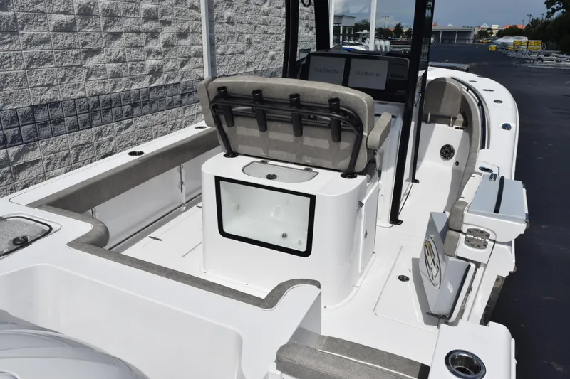 Slide: The Image of 2026 Sea Hunt Gamefish 25 boat interior with seating and storage compartments. - 6