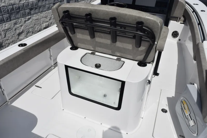 Slide: The Image of 2026 Sea Hunt Gamefish 25 boat interior with rod holders and storage compartment. - 7