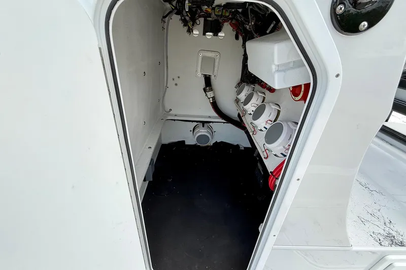 Slide: The Image of Interior view of 2024 Shallow Sport 25 X3 boat, showcasing wiring and components. - 12