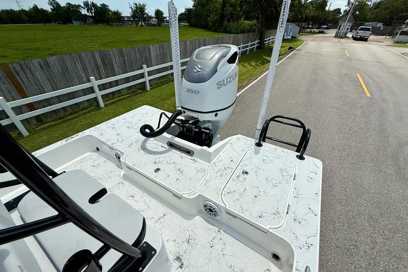 Slide: The Image of 2024 Shallow Sport 25 X3 boat with Suzuki 350 outboard motor on a road. - 7