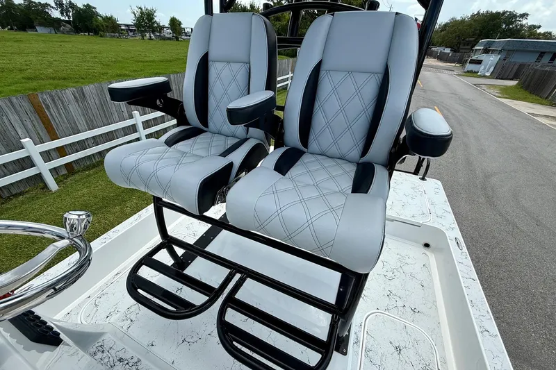 Slide: The Image of 2024 Shallow Sport 25 X3 boat seats with armrests and diamond stitching. - 9