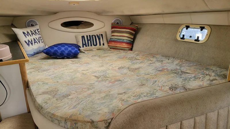 Slide: The Image of Cozy cabin interior of 1994 Maxum 3200 SCR with decorative pillows and nautical theme. - 19