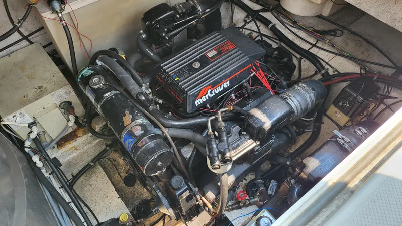 Slide: The Image of Engine compartment of a 1994 Maxum 3200 SCR boat, featuring a MerCruiser engine. - 23