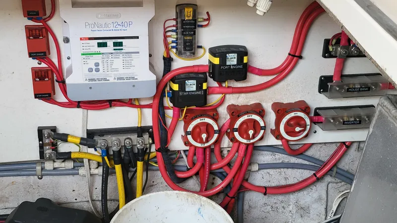 Slide: The Image of Electrical system of a 1994 Maxum 3200 SCR boat with wiring and control panels. - 25