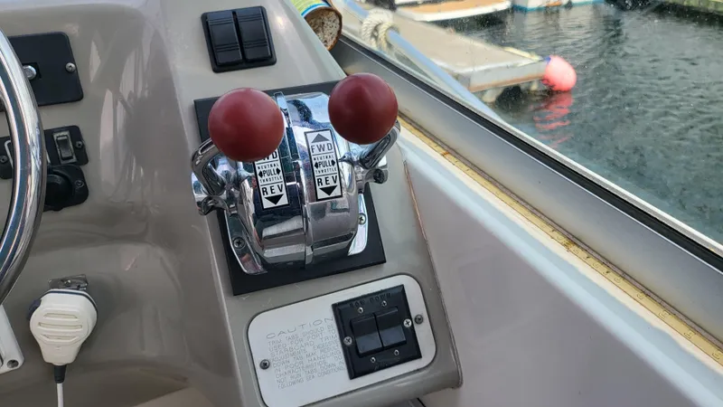 Slide: The Image of Throttle controls on a 1994 Maxum 3200 SCR boat, dockside view. - 9