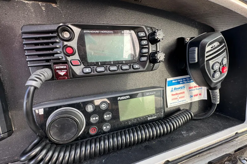Slide: The Image of VHF radio and audio system on a 2002 Boston Whaler 210 Ventura boat. - 26