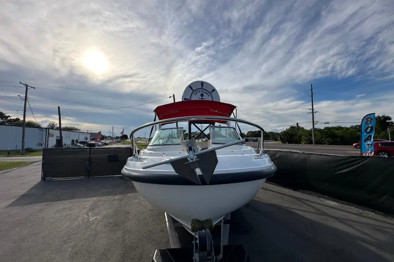 Slide: The Image of 2002 Boston Whaler 210 Ventura boat on trailer under cloudy sky. - 4
