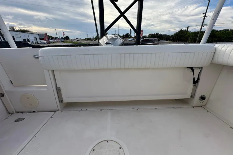 Slide: The Image of 2002 Boston Whaler 210 Ventura boat interior with white seating and open deck. - 44
