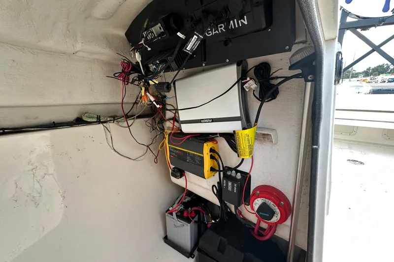 Slide: The Image of Electrical setup inside a 2002 Boston Whaler 210 Ventura boat, featuring Garmin equipment. - 68