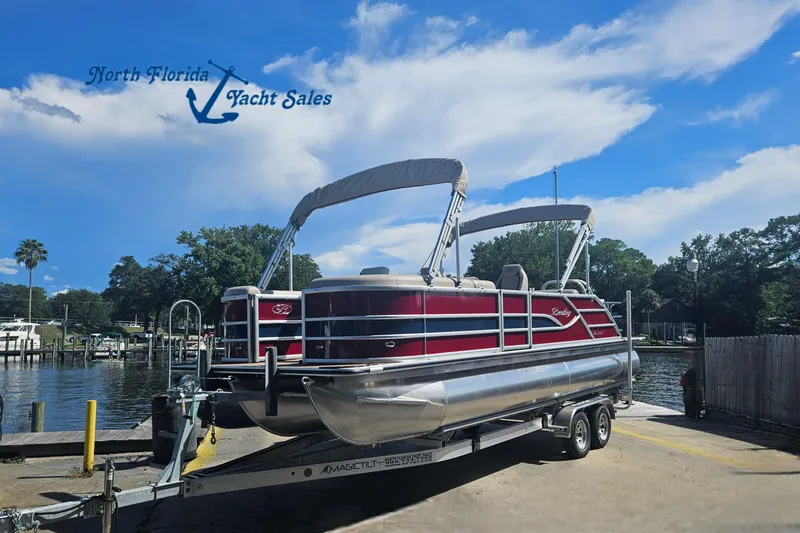 The Image of 2025 Bentley Pontoons Legacy 243 Swingback on trailer at North Florida Yacht Sales. - 0