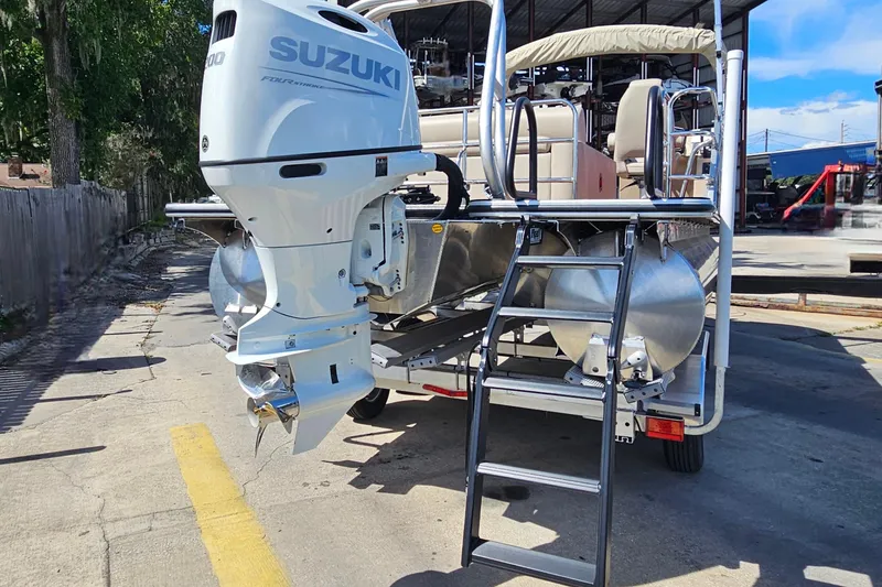 Slide: The Image of 2025 Bentley Pontoons Legacy 243 Swingback with Suzuki outboard motor and ladder. - 5