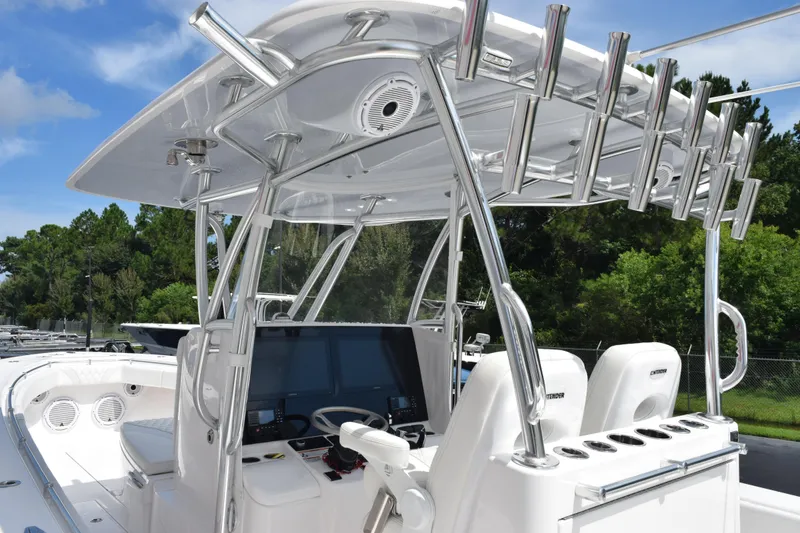 Slide: The Image of 2025 Contender 35 ST boat interior with advanced navigation system and rod holders. - 10