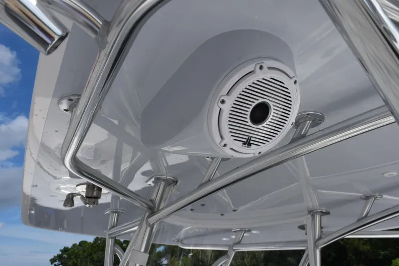 Slide: The Image of 2025 Contender 35 ST boat with mounted speaker on T-top against blue sky. - 12