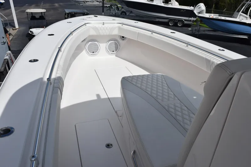 Slide: The Image of 2025 Contender 35 ST boat interior with white seating and speakers. - 15