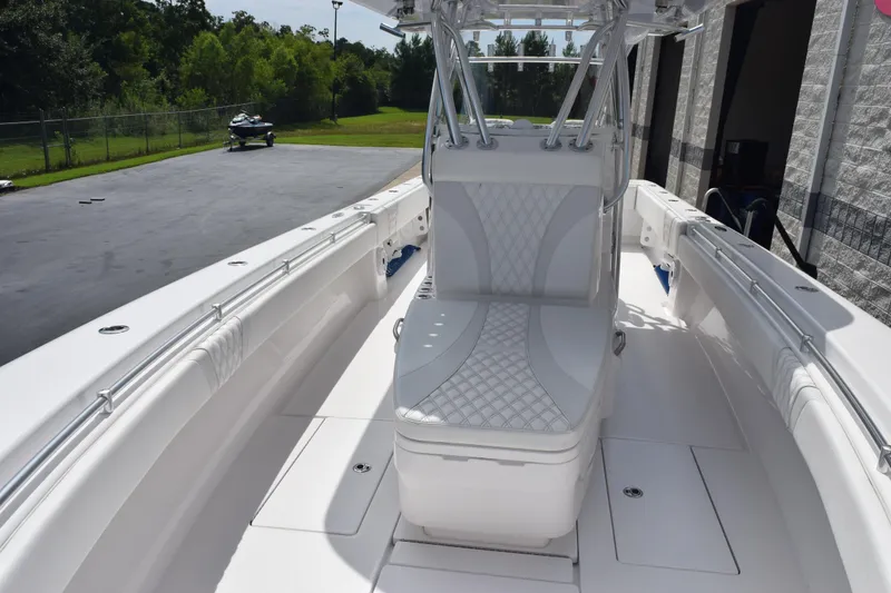 Slide: The Image of 2025 Contender 35 ST boat interior with white seating and sleek design. - 17