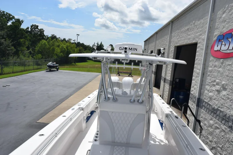 Slide: The Image of 2025 Contender 35 ST boat parked outside a building under a clear sky. - 18
