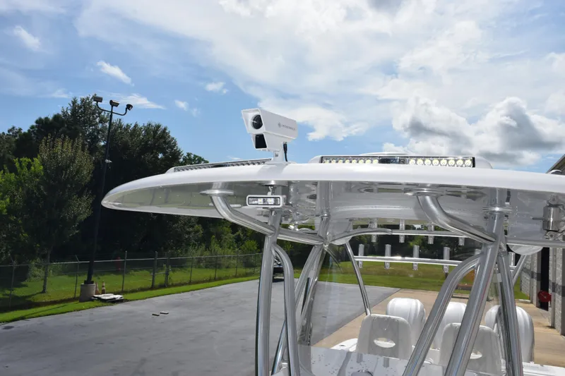 Slide: The Image of 2025 Contender 35 ST boat with advanced radar system and sleek design. - 19