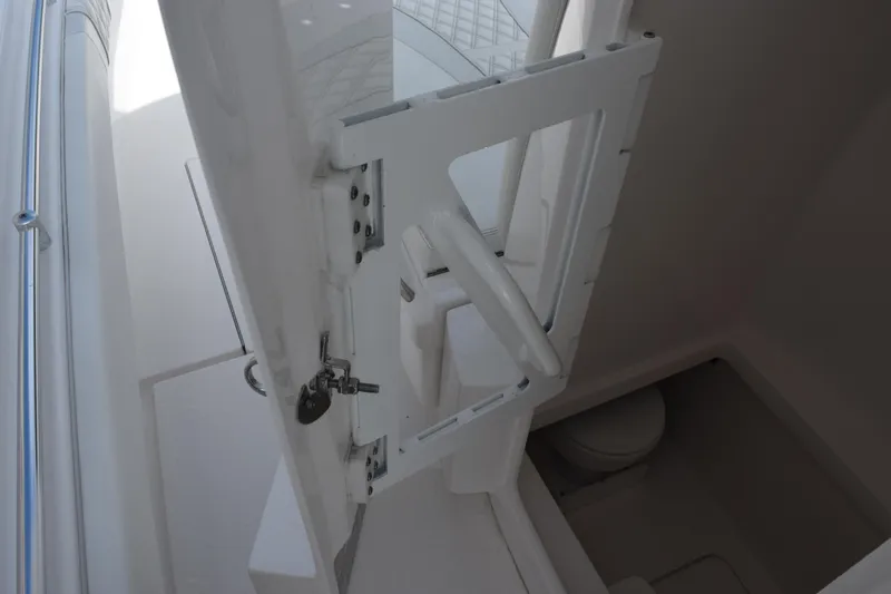 Slide: The Image of Contender 35 ST 2025 boat interior with open door and visible toilet compartment. - 21