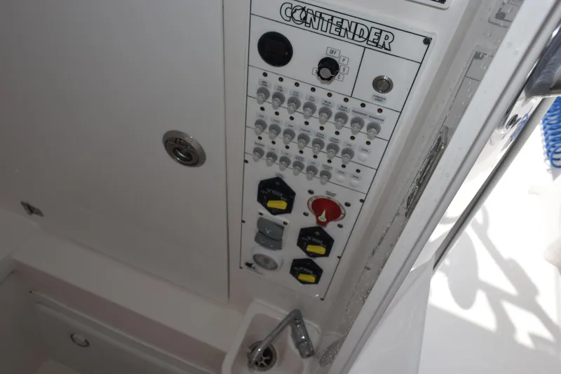 Slide: The Image of Control panel of 2025 Contender 35 ST boat with switches and dials. - 24