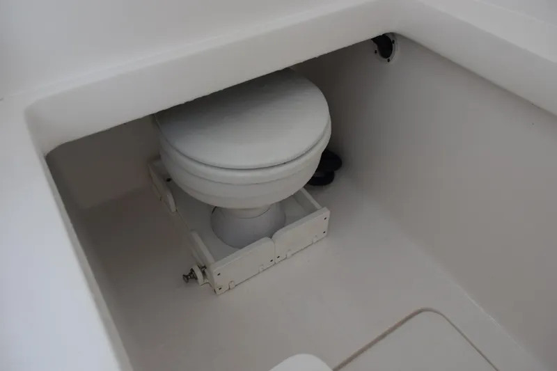 Slide: The Image of Boat toilet in 2025 Contender 35 ST model, white interior. - 25
